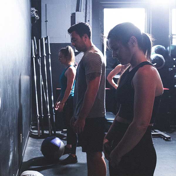 Two women and one men getting ready for training