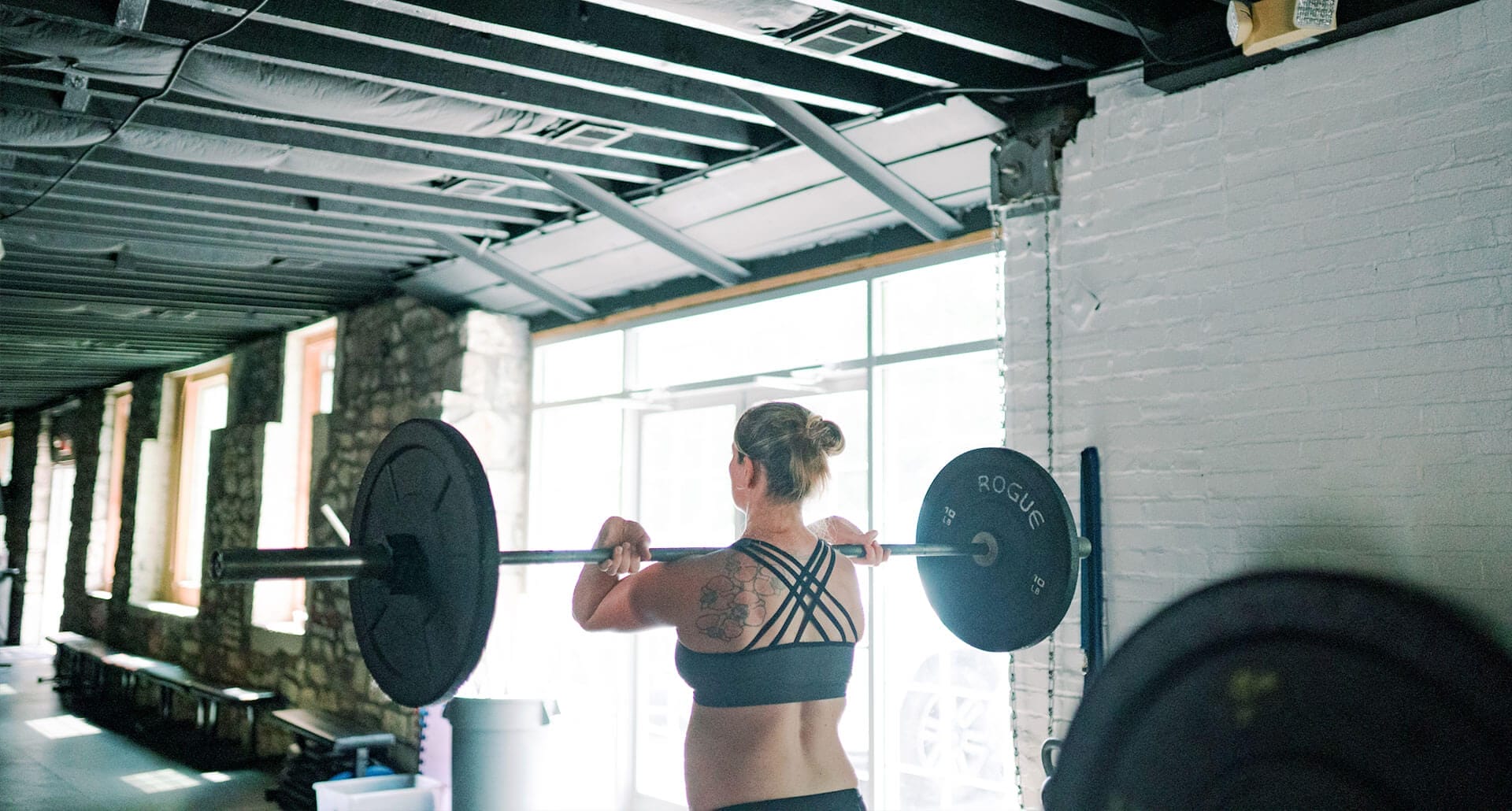 Woman lifting in our gym